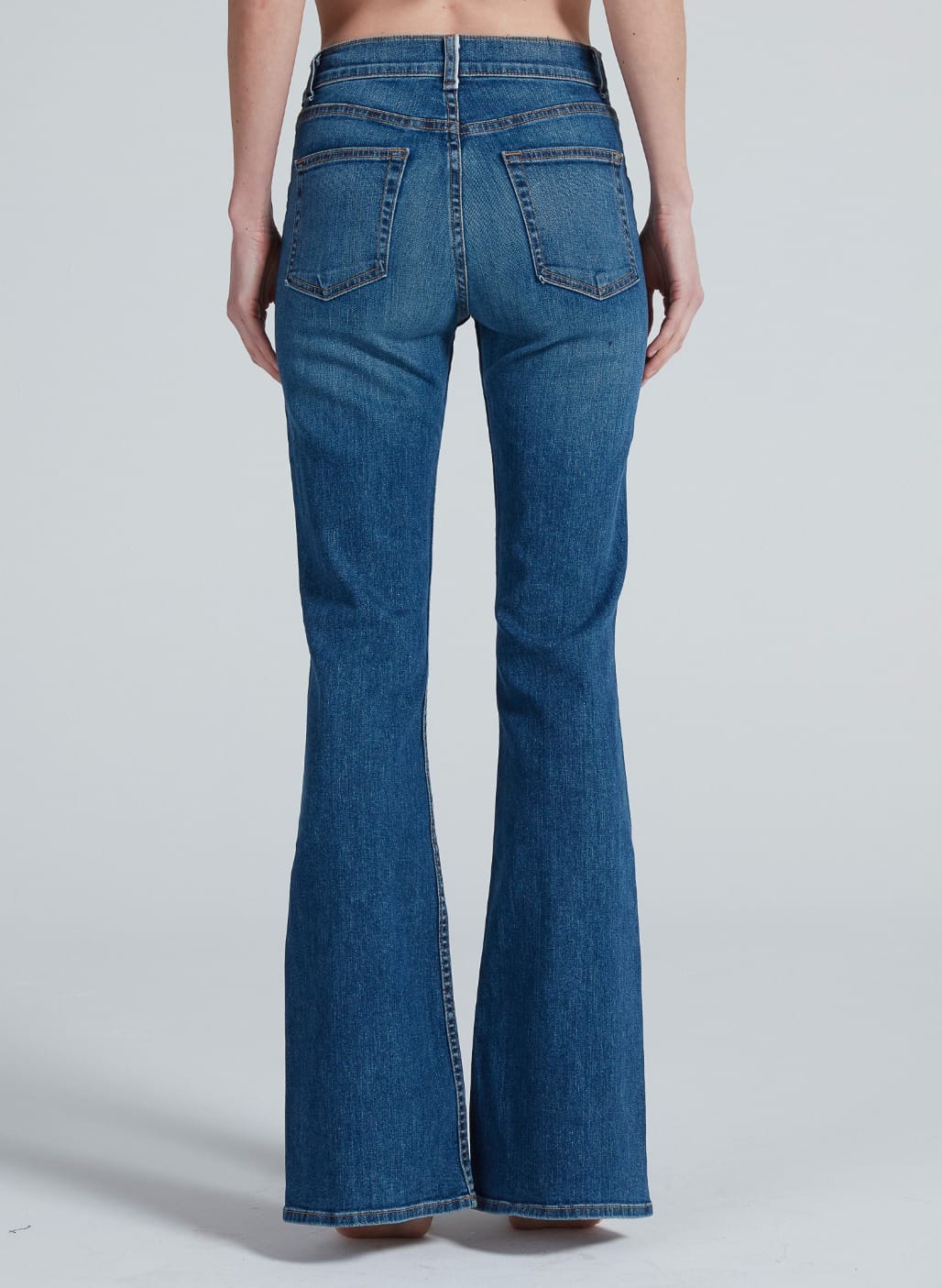 Back view of ASKK Bond Street bootcut jeans in medium blue denim wash