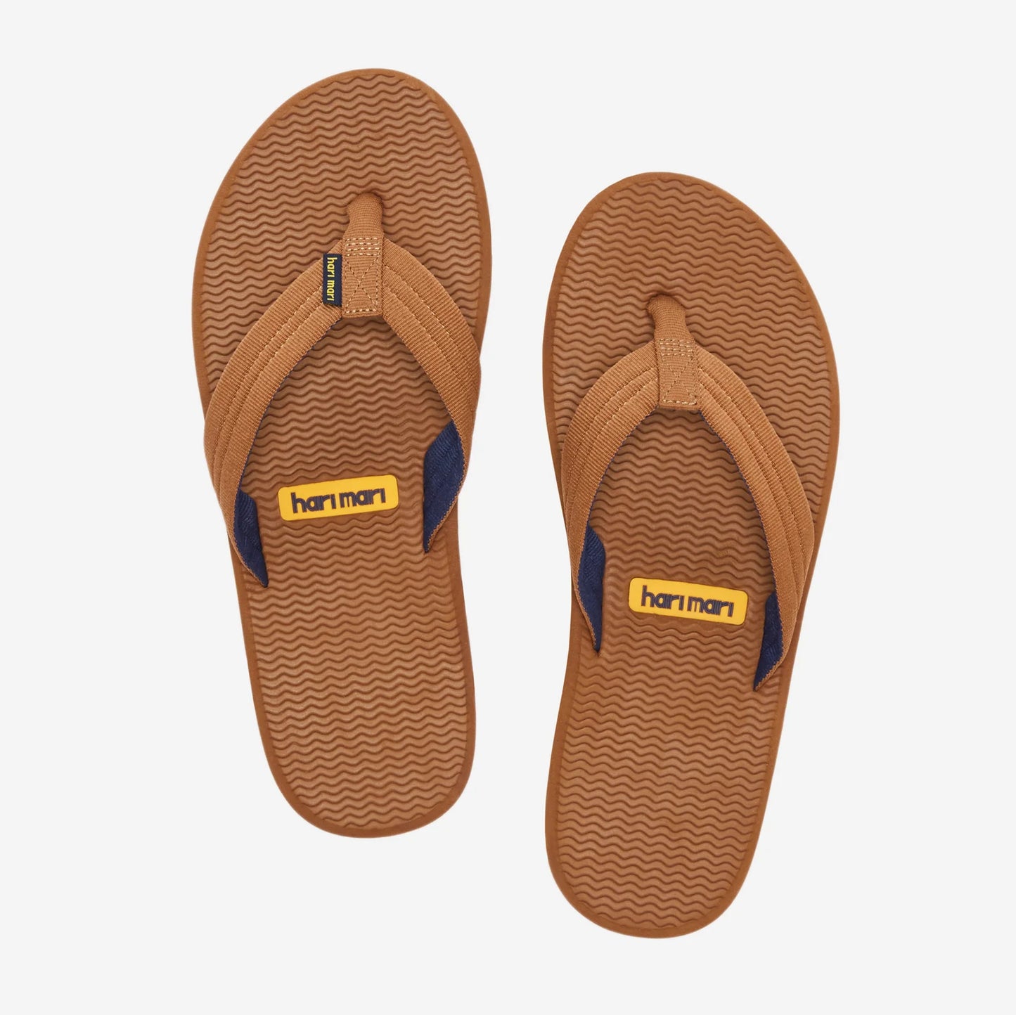 Hari Mari brown flip flop sandals with textured rubber soles and woven toe straps, shown from above