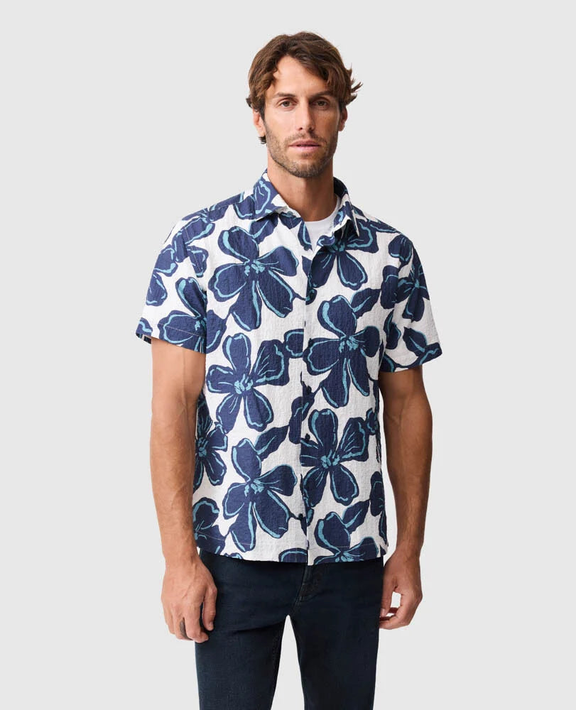 Rodd & Gunn Hamilton Bay short sleeve shirt featuring blue floral print on white background worn by male model