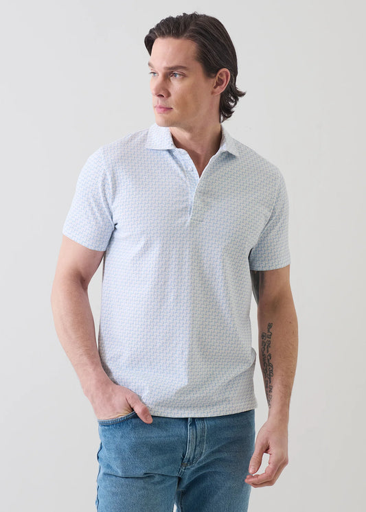 Patrick Assaraf short sleeve polo shirt with mini floral print pattern, worn by male model with jeans.