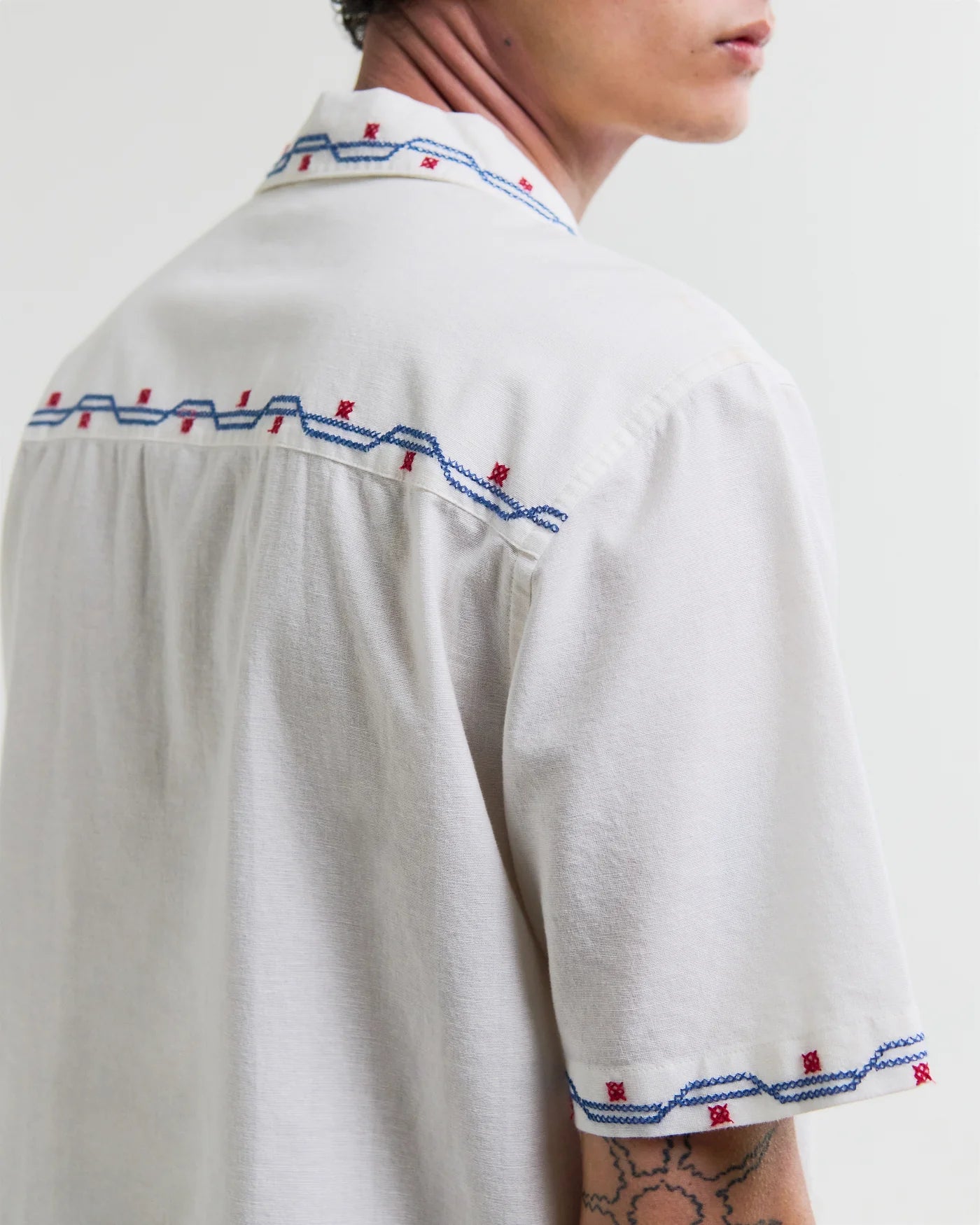 Wax London Didcot short sleeve shirt in ecru with blue and red cross stitch embroidered border trim.