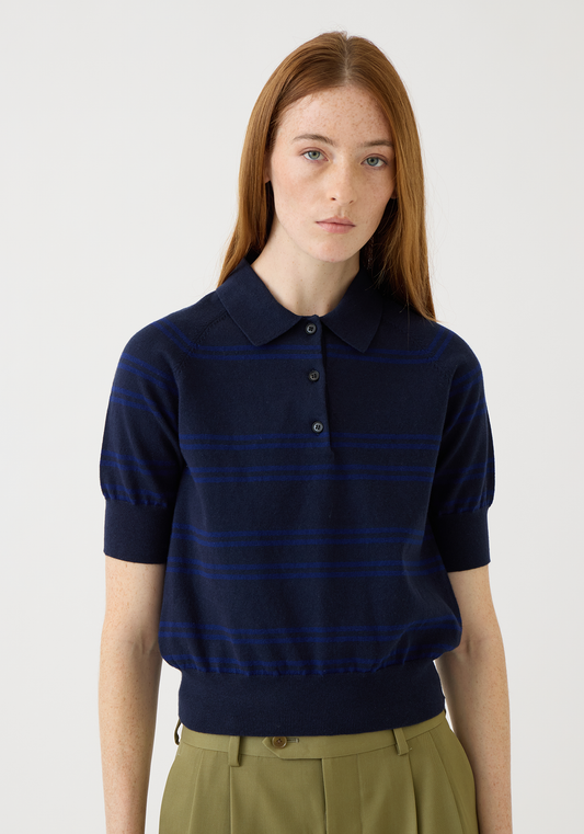 Woman wearing navy and baltic blue striped cotton cashmere polo top with short sleeves