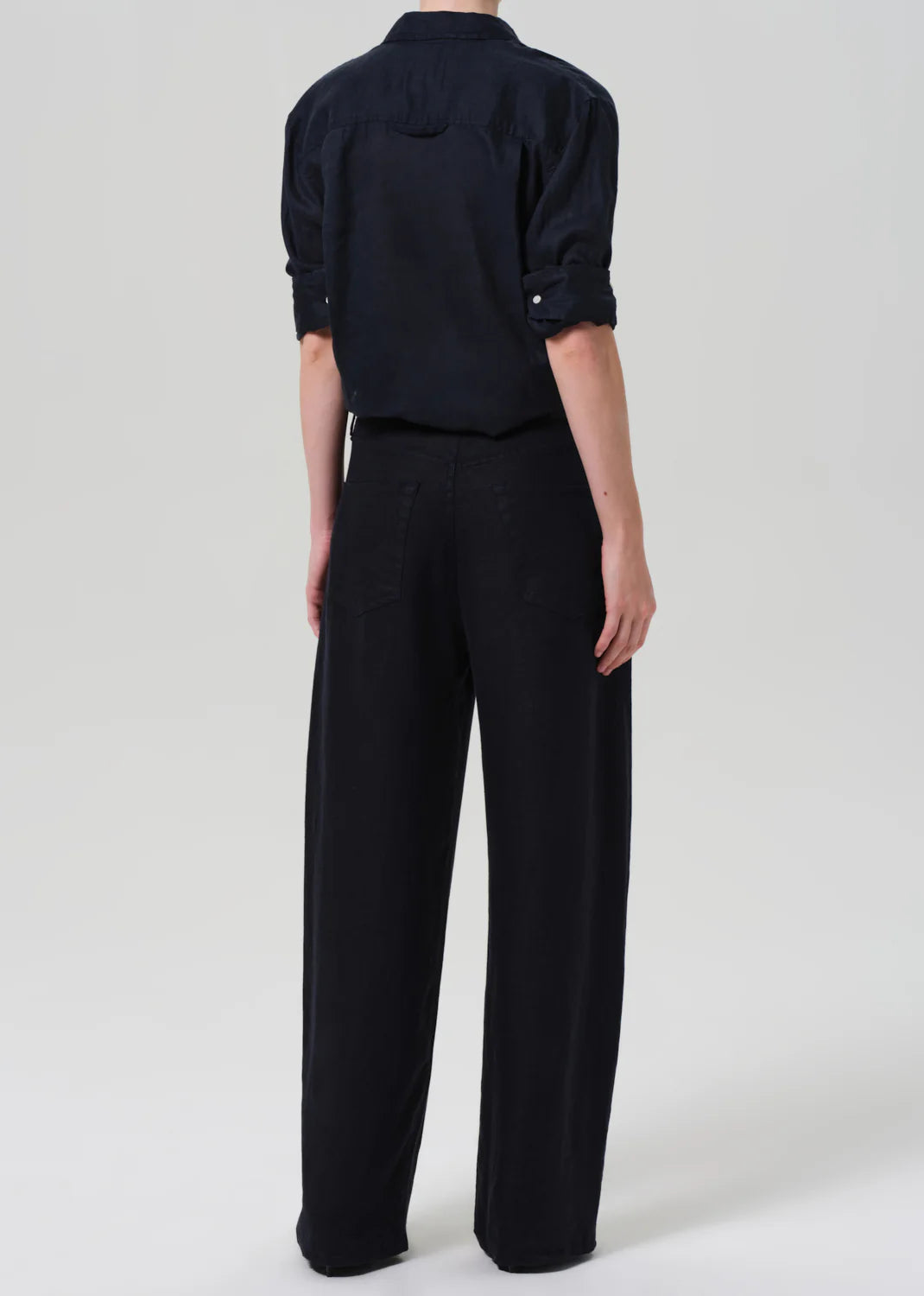 Citizens of Humanity Brynn drawstring trousers in navy linen, shown from behind with relaxed wide-leg silhouette and match...