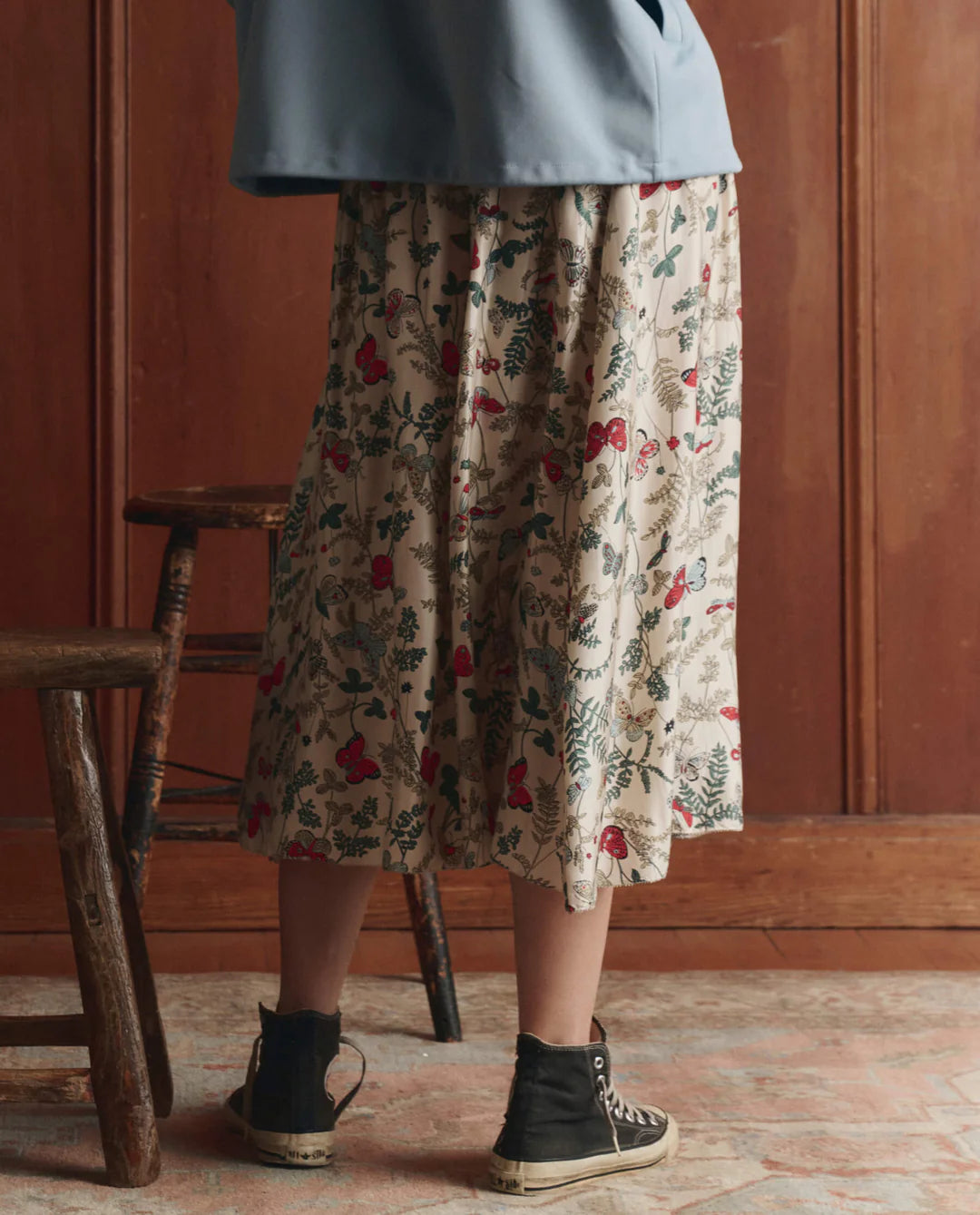 The GREAT The Canary Skirt in floating butterfly print, featuring a flowing midi-length silhouette with floral pattern.