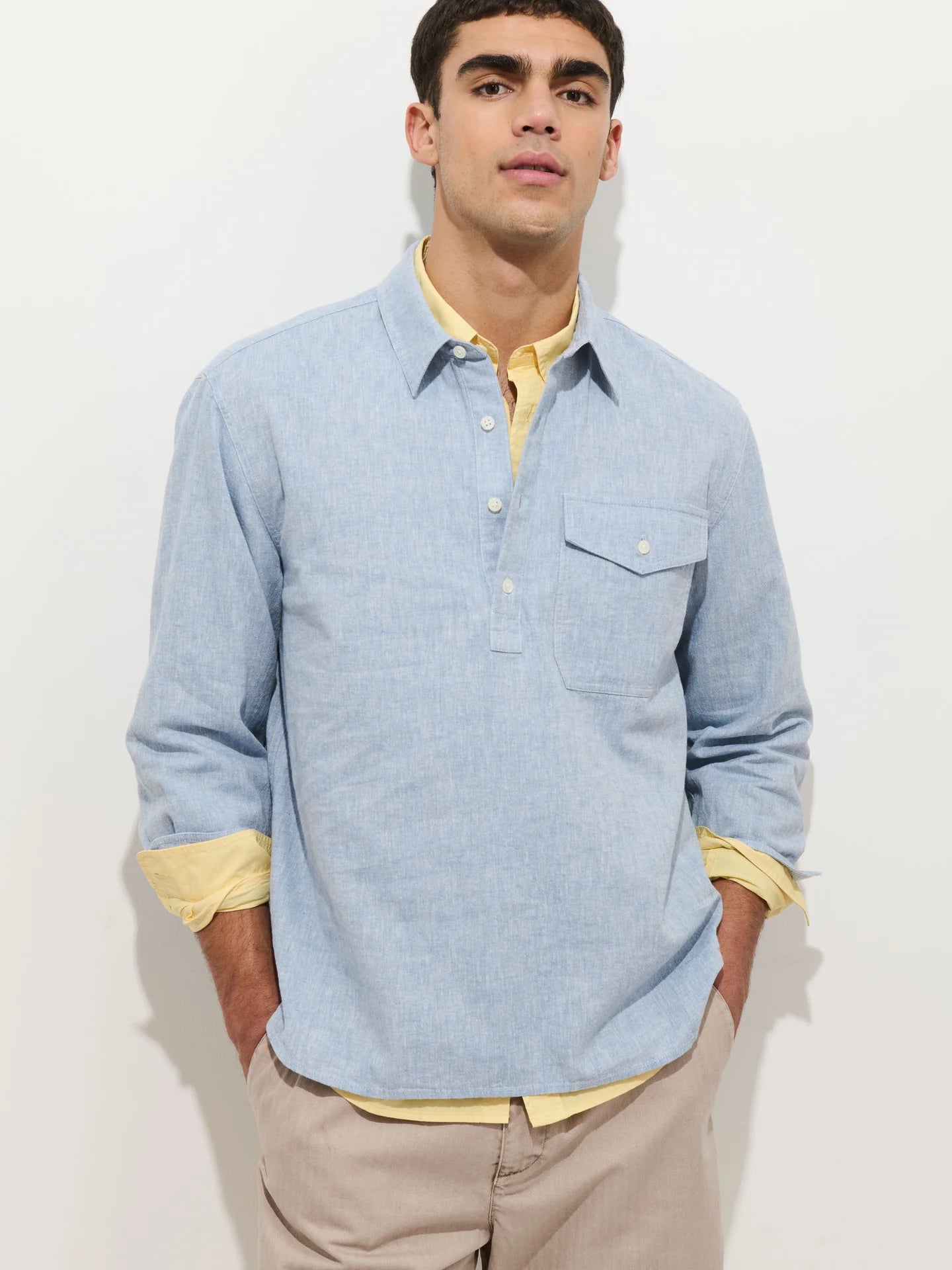Alex Mill Carter long-sleeve popover shirt in light blue cotton linen with chest pocket and layered styling.