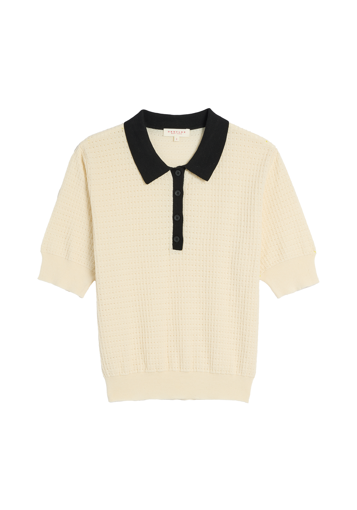 Cream colored waffle knit polo top with black collar and buttons
