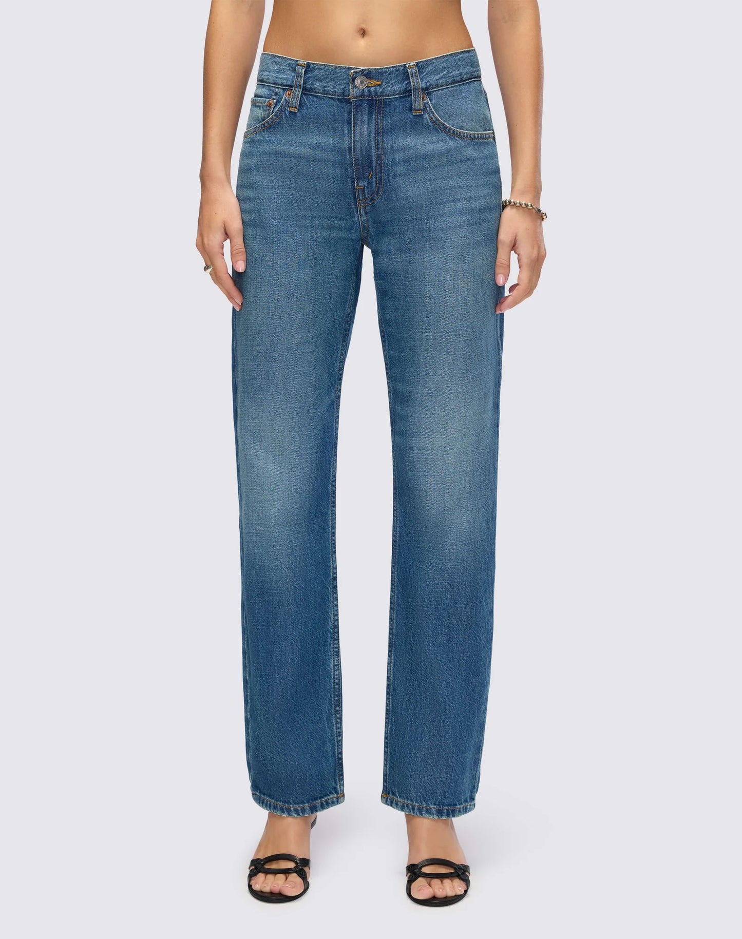 Re/Done Mid Rise Blondie Crop jeans in medium wash denim with straight leg silhouette and cropped length.