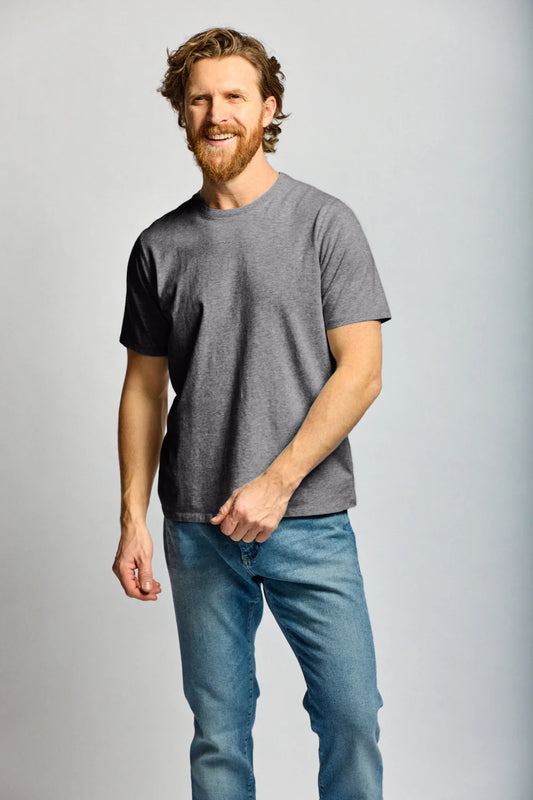Easy Mondays charcoal crew neck t-shirt worn by smiling man with beard in casual jeans pose