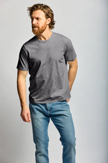 Man wearing Easy Mondays charcoal crew neck t-shirt with jeans in casual pose against neutral background.