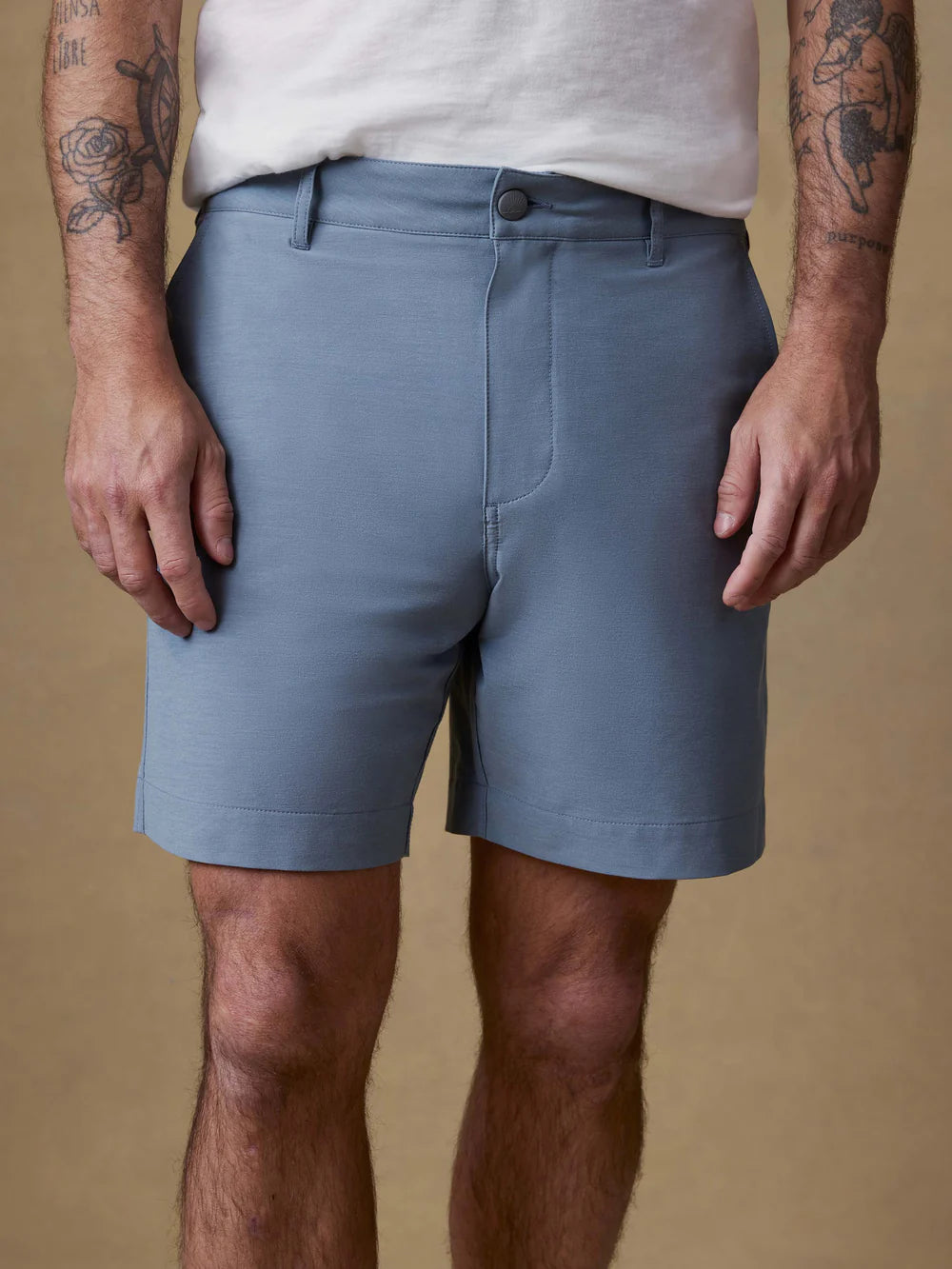 Man wearing Faherty All Day Shorts in blue, showing relaxed fit and 7-inch inseam length.
