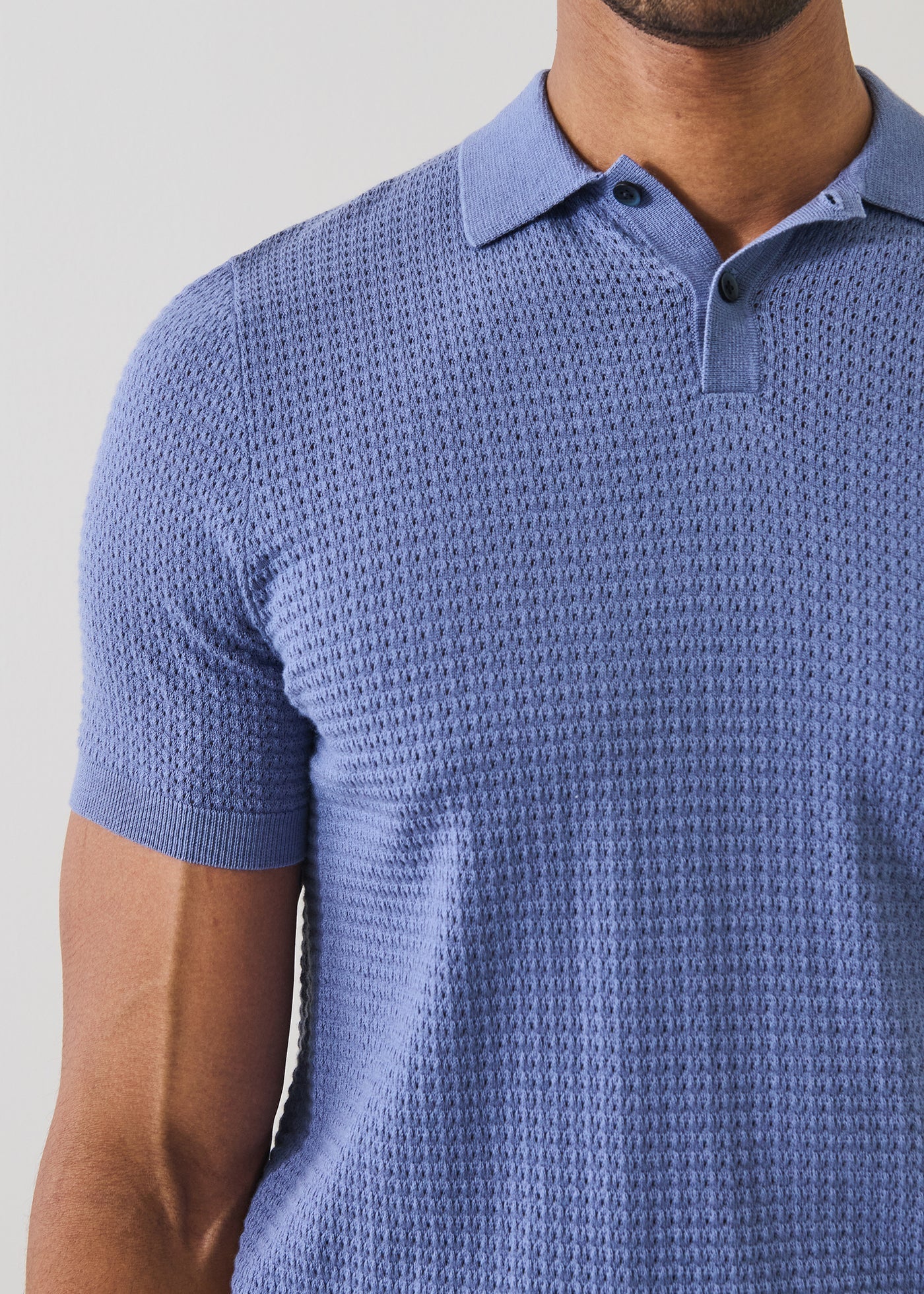 Patrick Assaraf short sleeve cotton cashmere performance stitch polo shirt with textured knit pattern and collar detail.