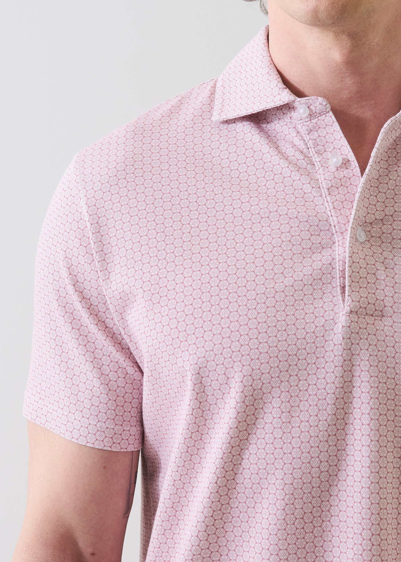 Patrick Assaraf short sleeve geometric print polo shirt in dusty pink worn by male model
