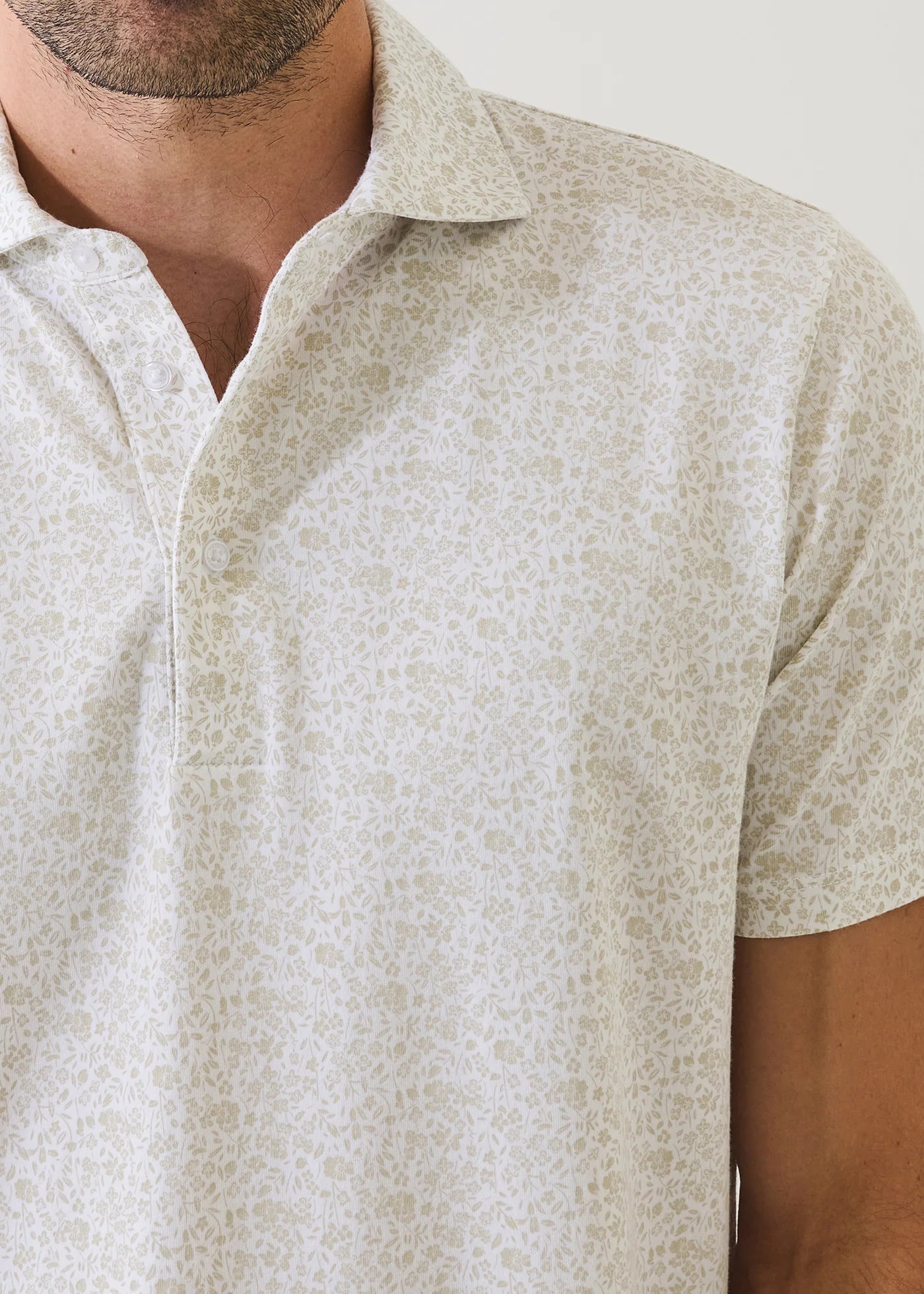 Patrick Assaraf short sleeve polo shirt featuring subtle mini floral print pattern and classic collar design.