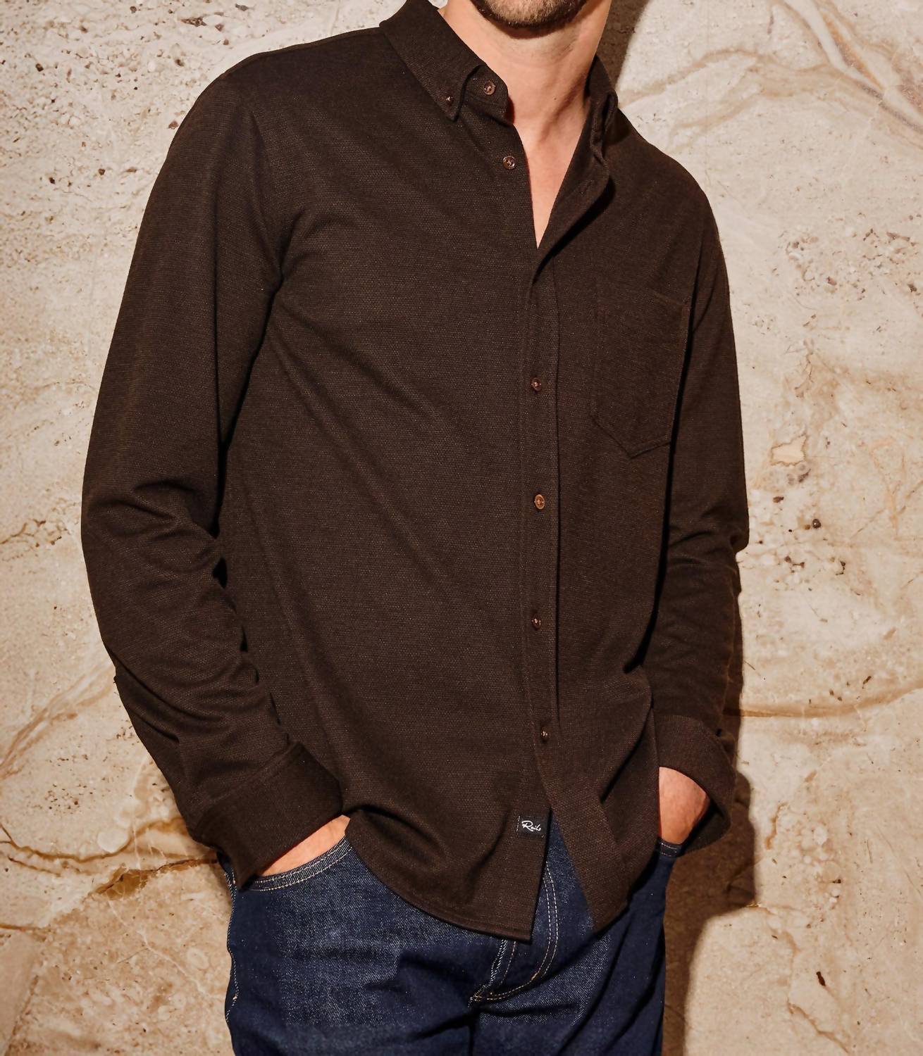 Male model wearing Rails Vincent long sleeve button-down shirt in dark espresso brown with jeans