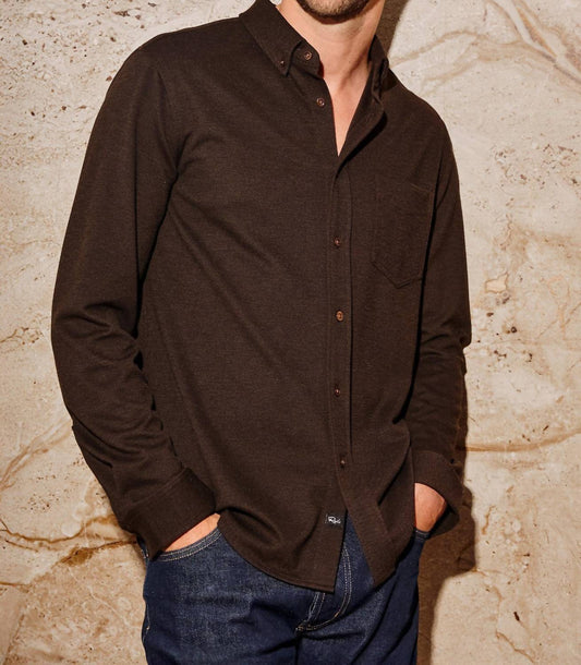 Male model wearing Rails Vincent long sleeve button-down shirt in dark espresso brown with jeans