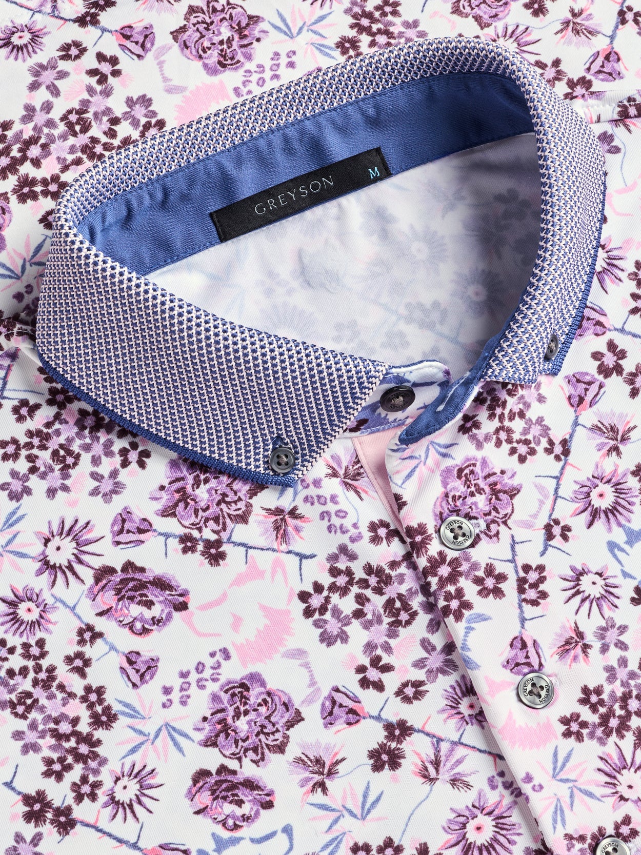 Greyson Silver Fang Polo in Arctic colorway featuring floral print pattern with contrasting collar detail and button placket.