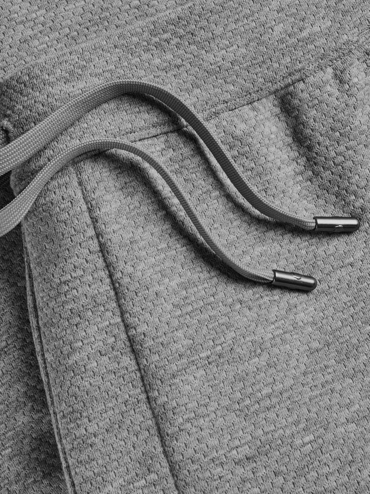 Close-up detail of grey heather jogger drawstring with metal aglet tips
