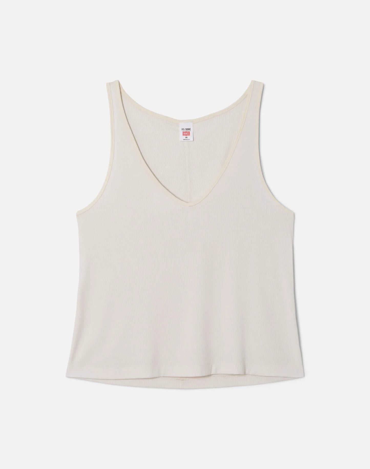 Re/Done cream colored slim fit v-neck tank top with brand label, displayed on neutral background.