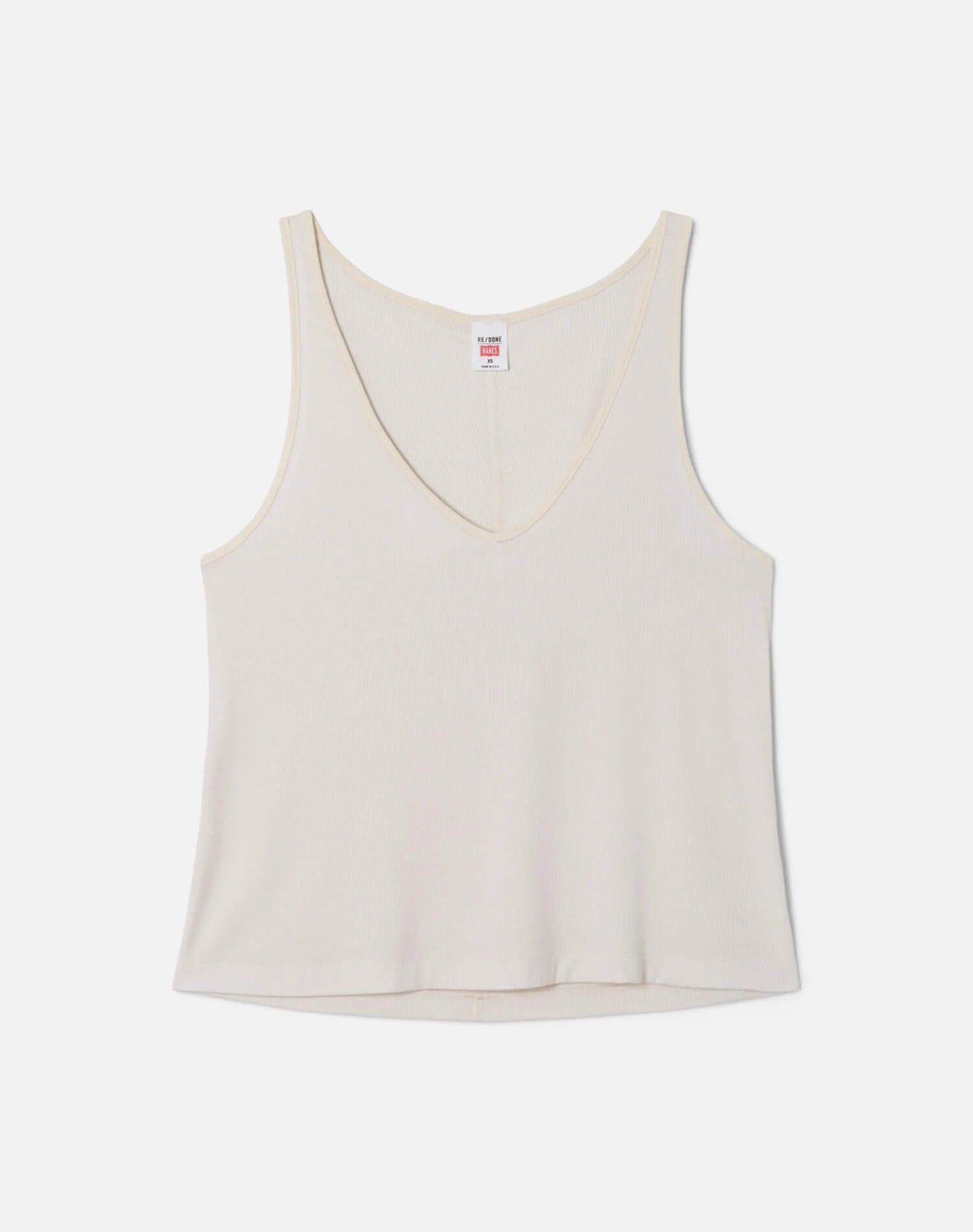 Re/Done cream colored slim fit v-neck tank top with brand label, displayed on neutral background.