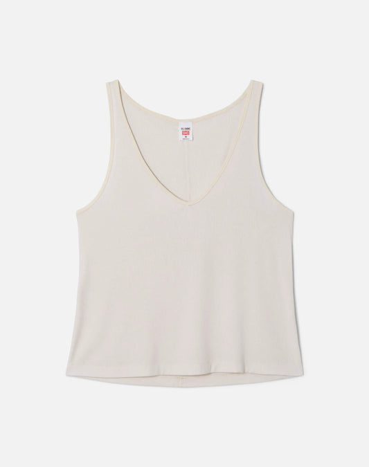 Re/Done cream colored slim fit v-neck tank top with brand label, displayed on neutral background.