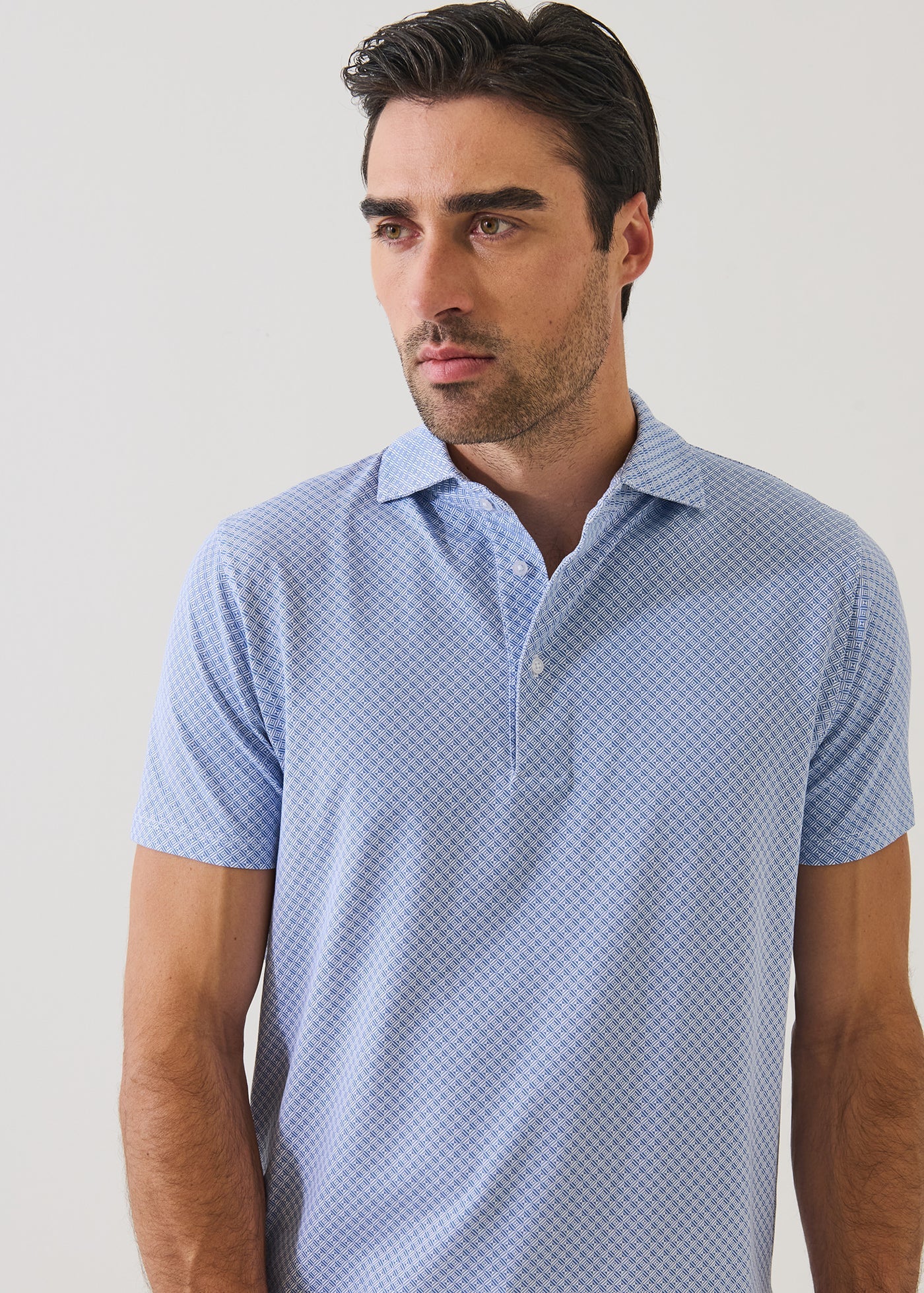 Patrick Assaraf short sleeve polo shirt with mini geometric print pattern and collar detail on male model