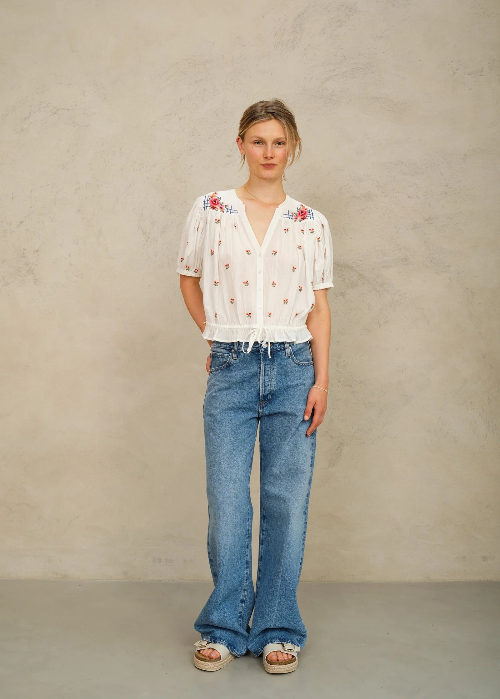 MABE Harlie embroidered short sleeve white floral top with V-neck and tie waist detail