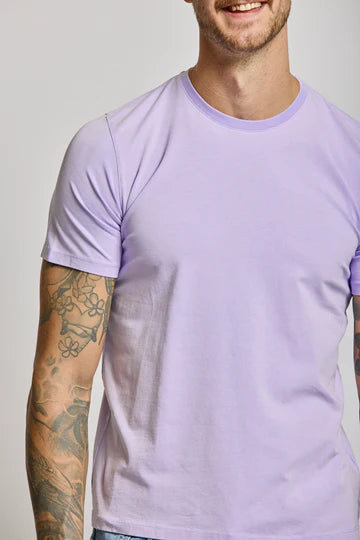 Easy Mondays crew neck t-shirt in lilac purple worn by tattooed man against neutral background