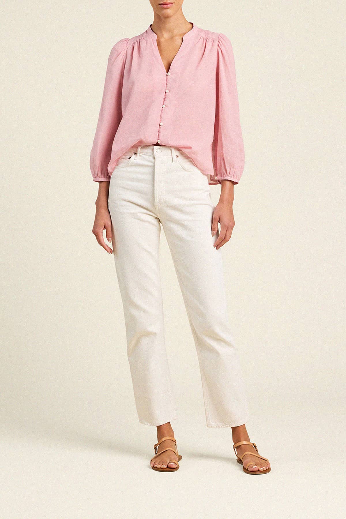 Trovata Maisey blouse in pink houndstooth with puffy sleeves and button-front closure, styled with white jeans.