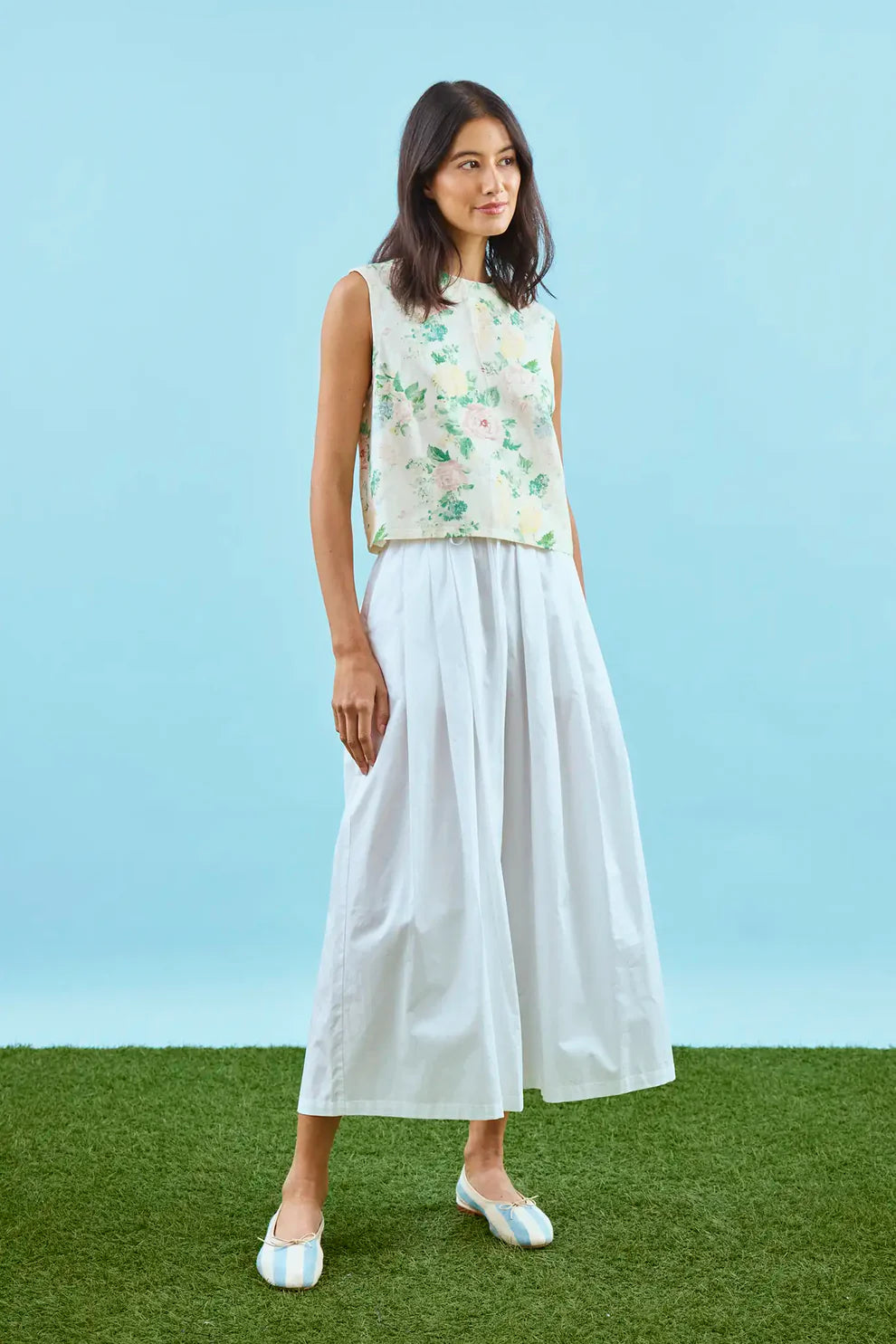 Hunter Bell Manning sleeveless floral top with garden rose peony print, styled with white wide-leg pants