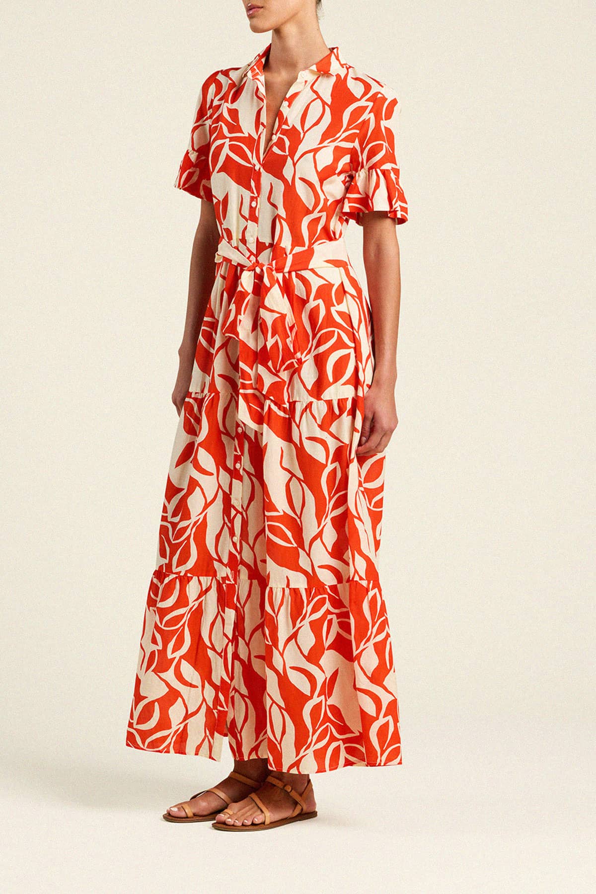 Trovata Martine maxi dress with red and cream leaf print, featuring tiered ruffles and short sleeves