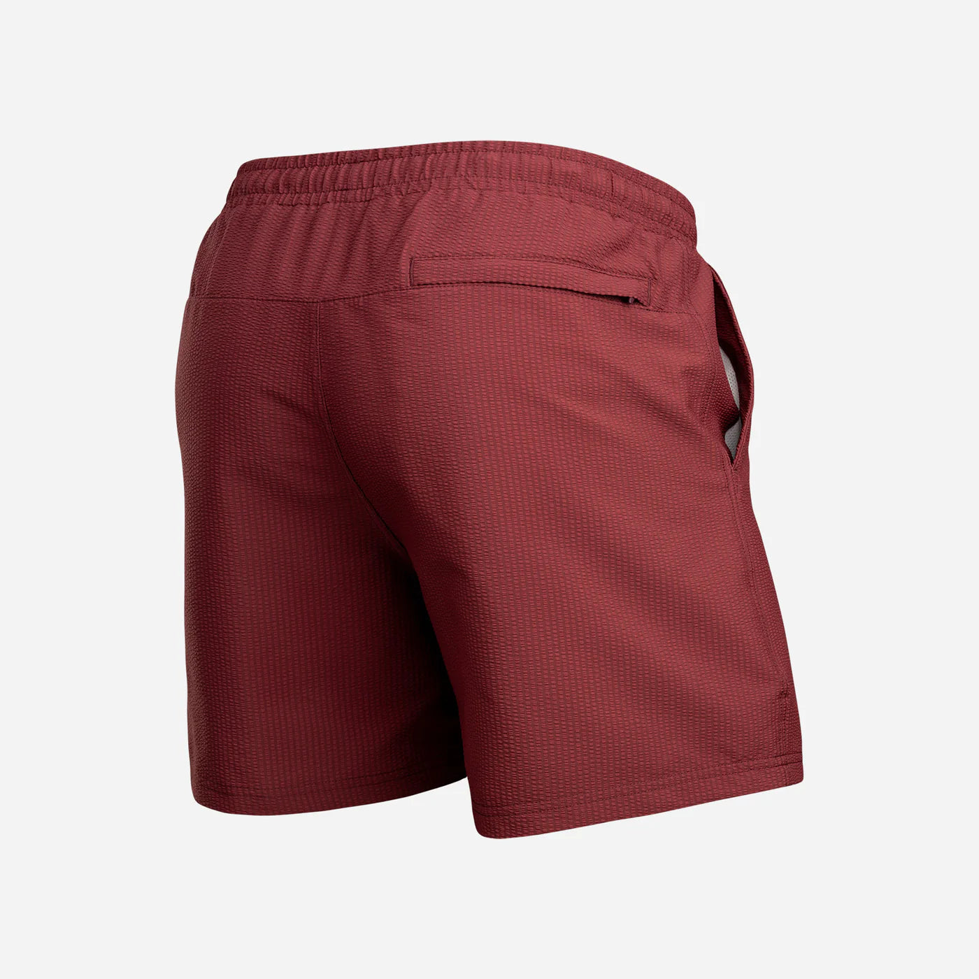 BN3TH Agua Wave men's swim trunks in red mahogany with elastic waistband and back pocket, rear view.