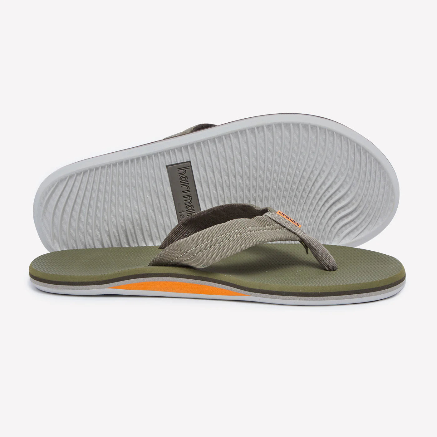 Hari Mari Dunes moss green flip flops with textured fabric straps and white ridged sole, shown from side angle.