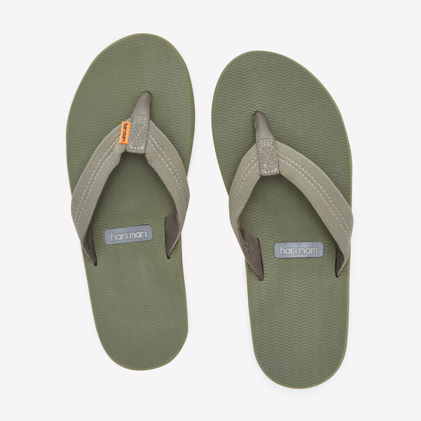 Hari Mari Dunes flip-flops in olive green with textured canvas straps and wavy patterned soles