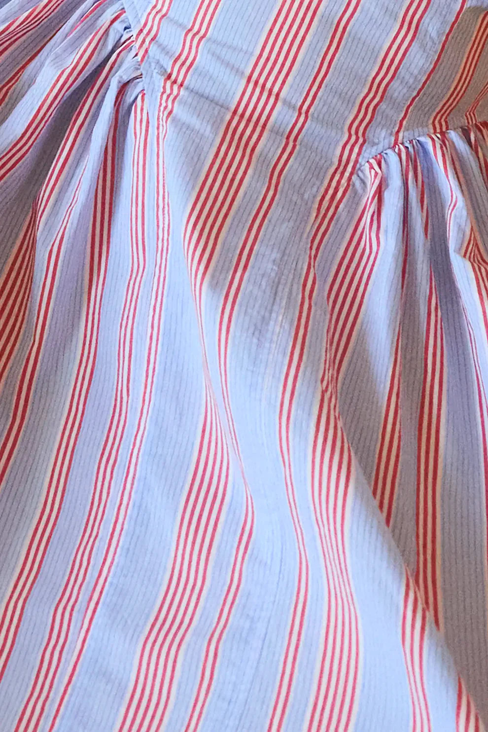Hunter Bell Nantucket dress featuring vertical red and white seaside stripes on flowing gathered fabric with elastic waist...