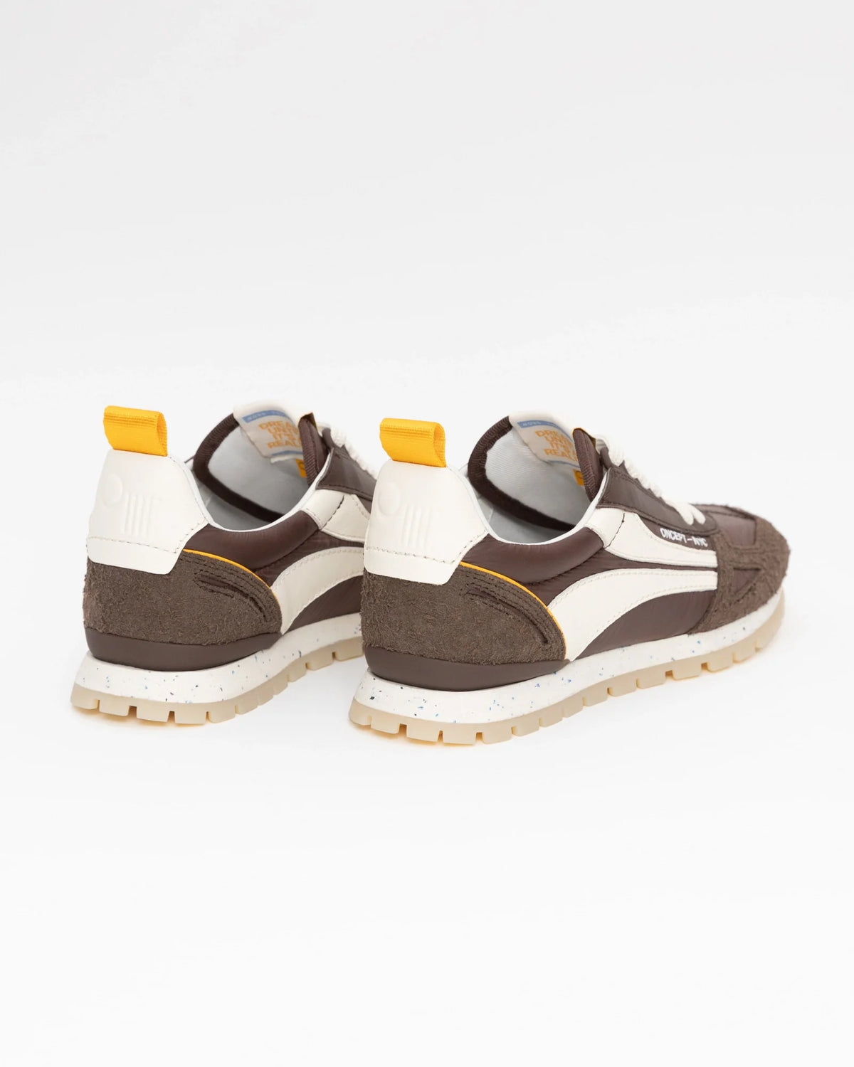 Rear view of Oncept Toronto mens sneakers in espresso brown with cream panels and yellow heel tab