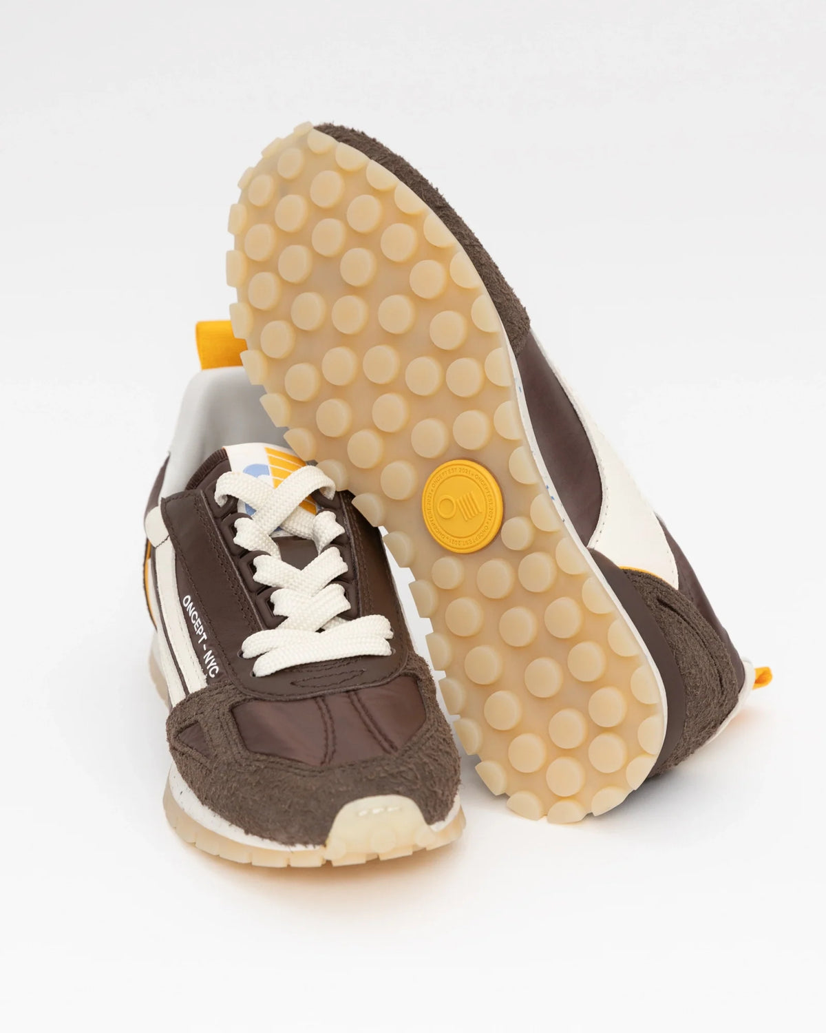 Oncept Toronto men's sneaker in espresso brown with cream laces and yellow accent details