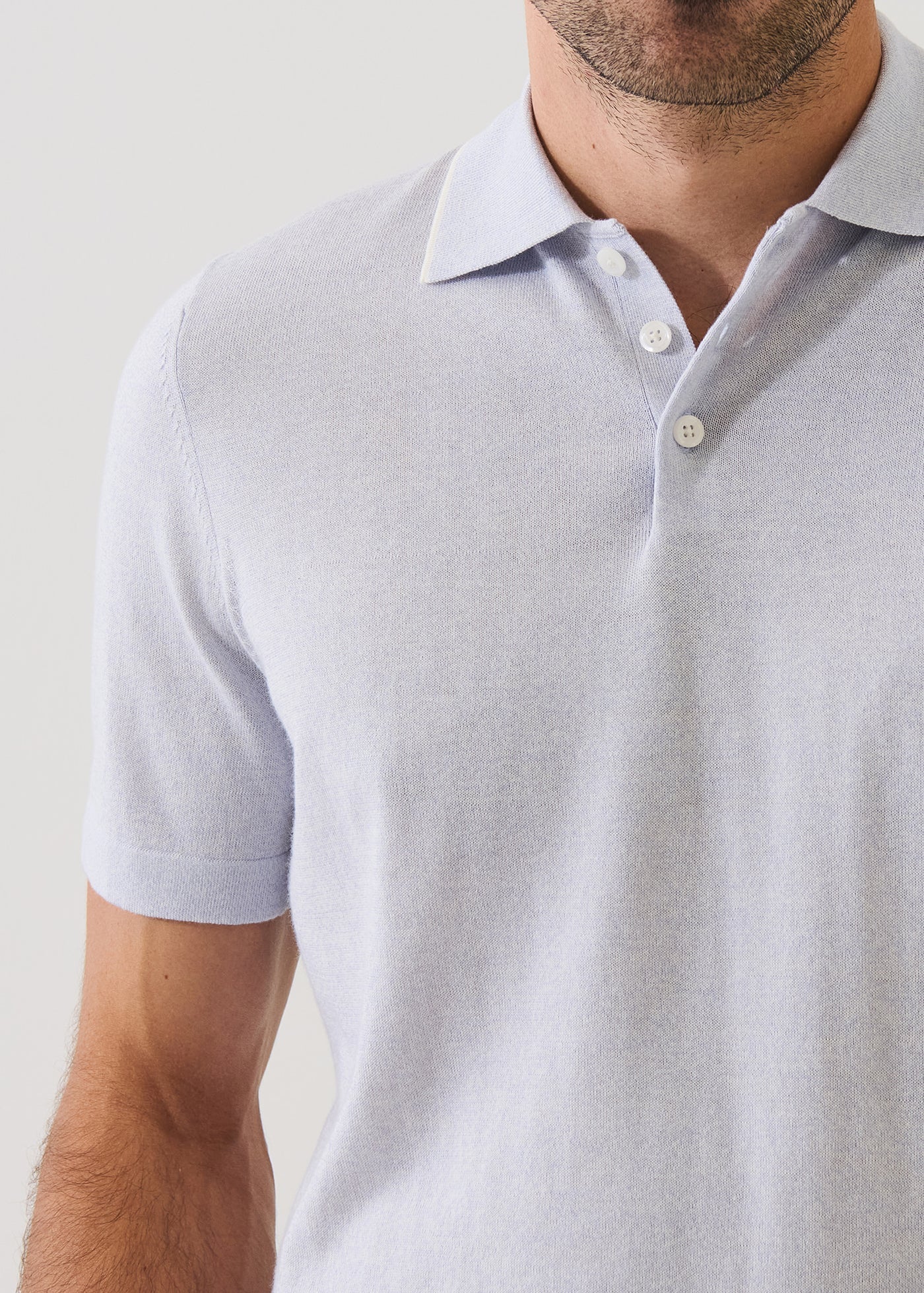 Patrick Assaraf short sleeve knit polo sweater with collar and button placket on male model