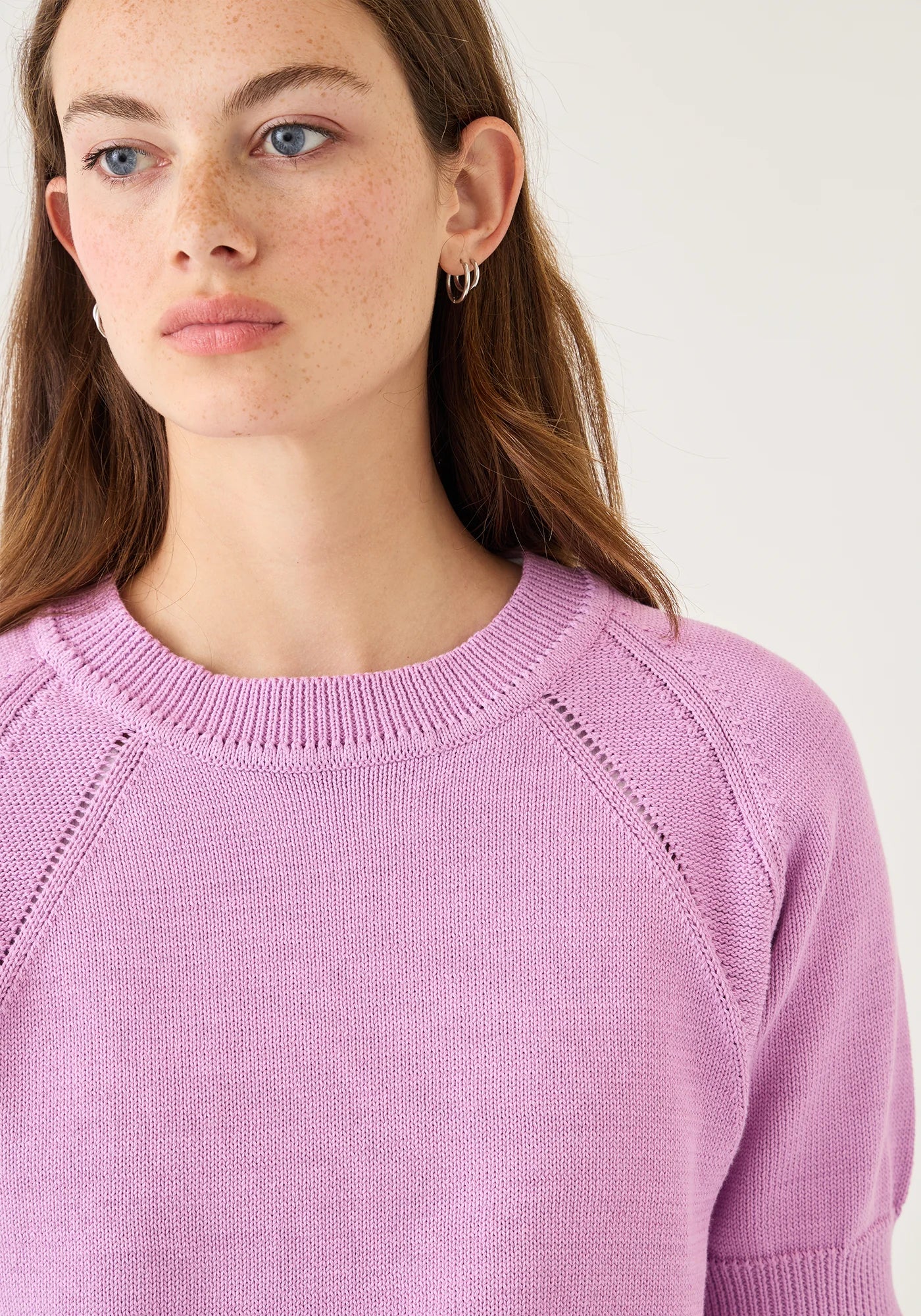 Demylee Arden Cotton Top in orchid purple featuring ribbed crew neck and decorative pointelle knit detailing