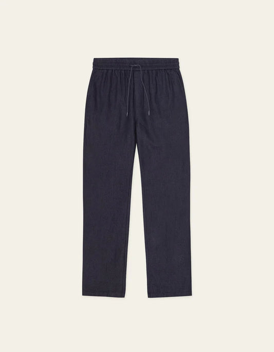 Les Deux Patrick dark navy linen pants with elastic waistband and drawstring closure, displayed flat against neutral backg...