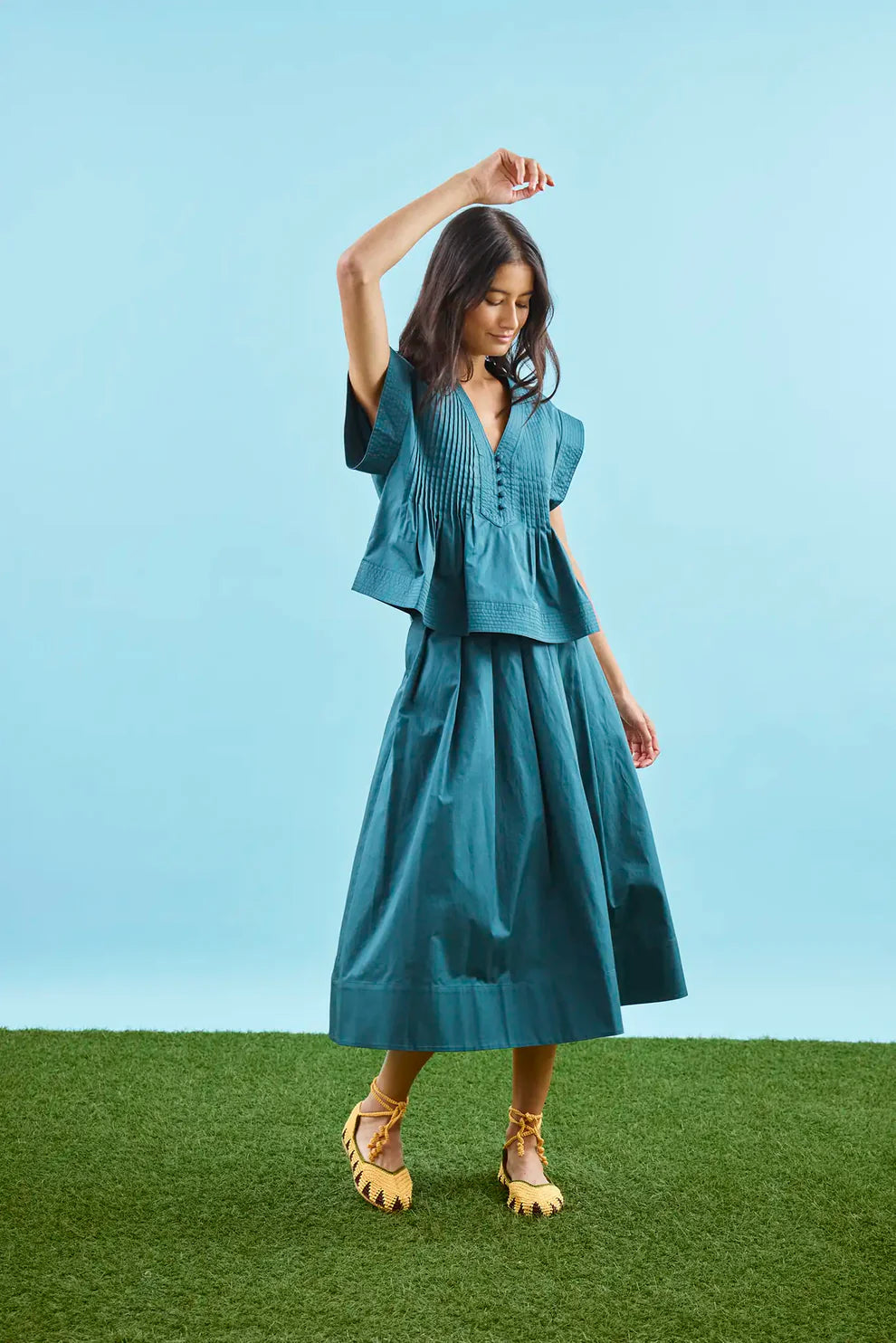 Hunter Bell Maison tiered midi skirt in petrol green cotton with gathered waistband and flowing silhouette.