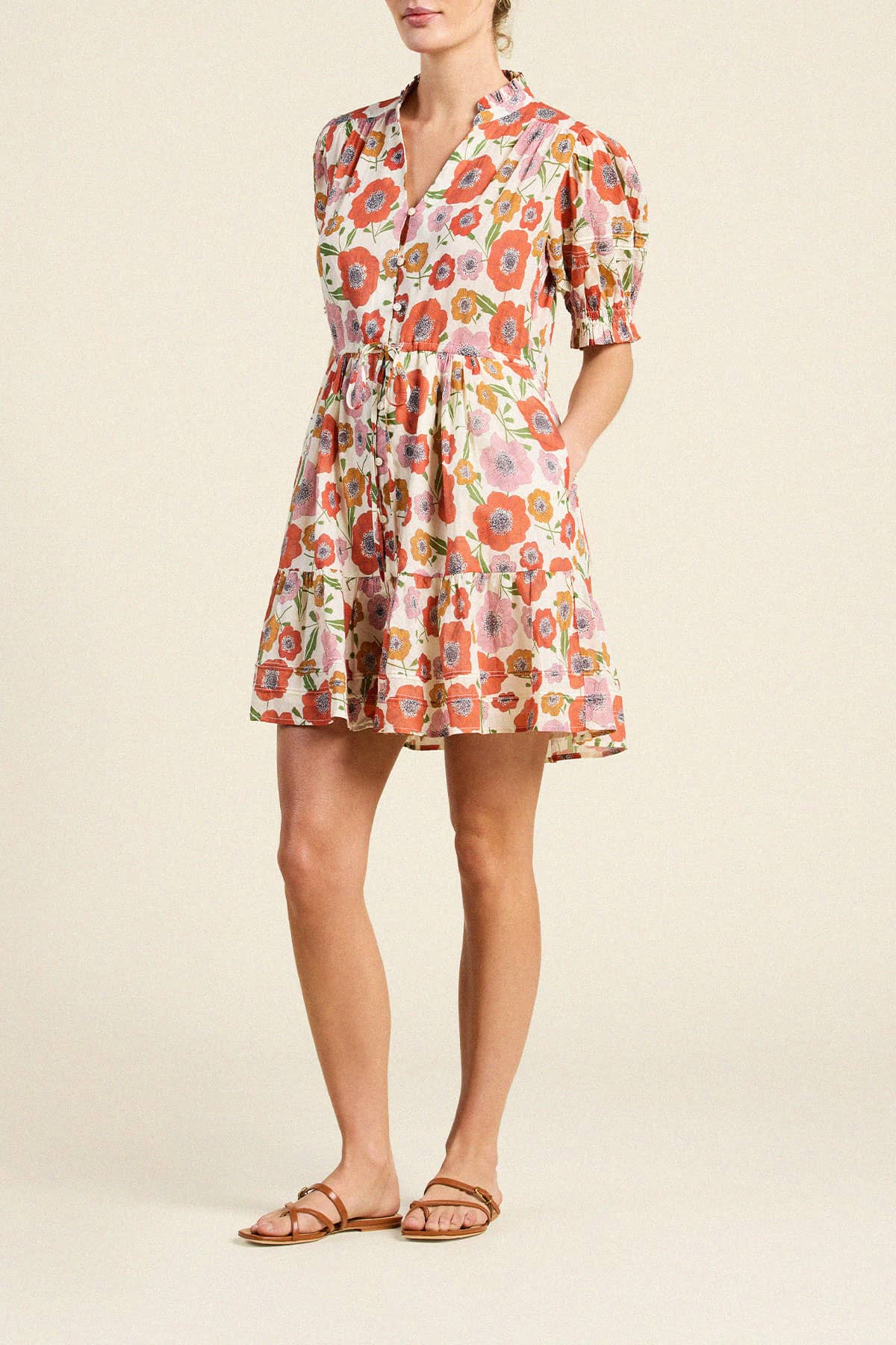 Trovata Phoebe mini dress featuring vibrant floral print, ruffled collar, puffed sleeves, and tiered skirt silhouette.