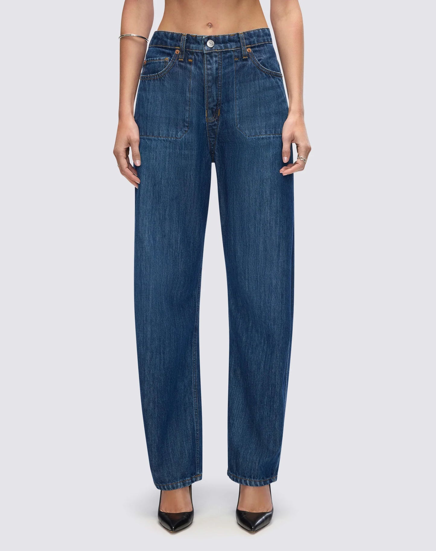 Re/Done high-waisted straight leg denim jeans with classic five-pocket styling and relaxed fit on model