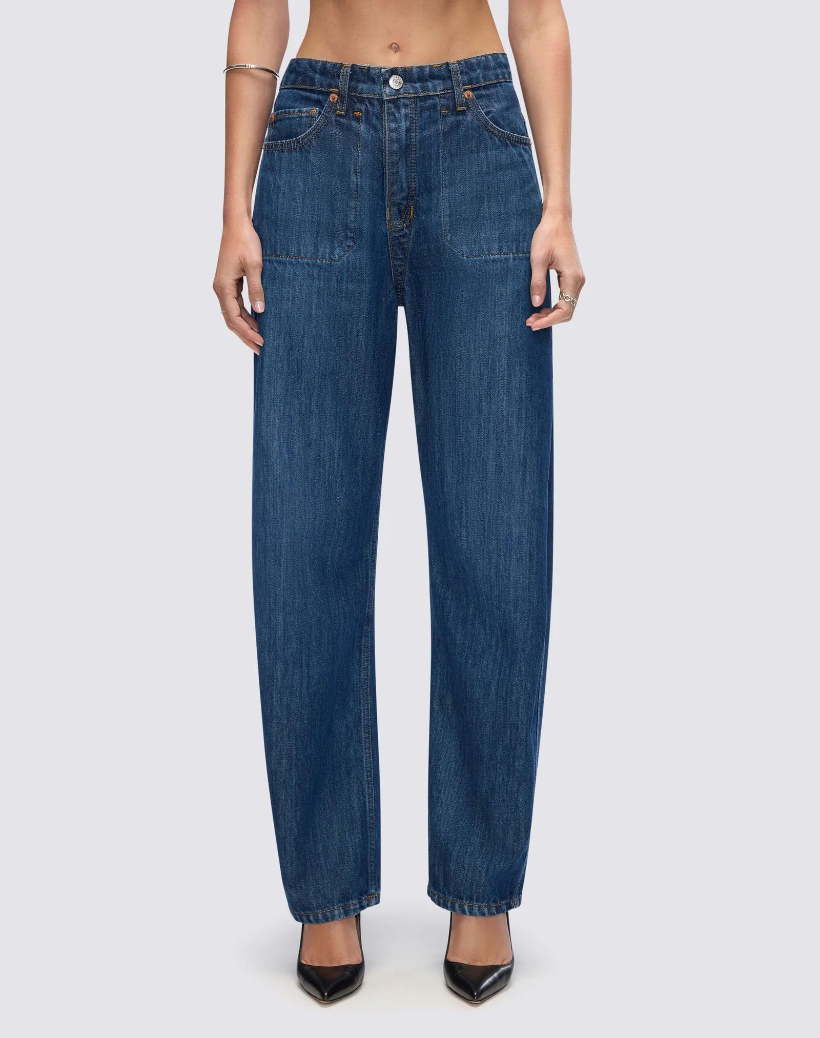 Re/Done high-waisted straight leg denim jeans with classic five-pocket styling and relaxed fit on model