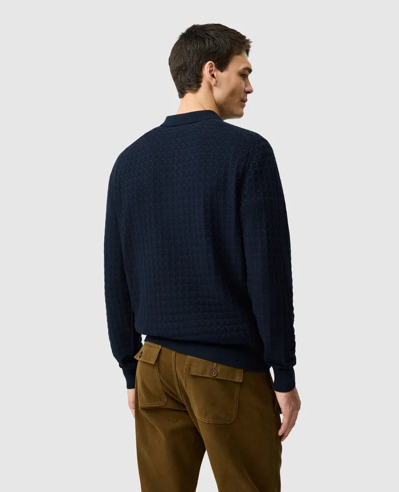 Rodd & Gunn navy knit sweater polo shown from behind on male model with brown trousers