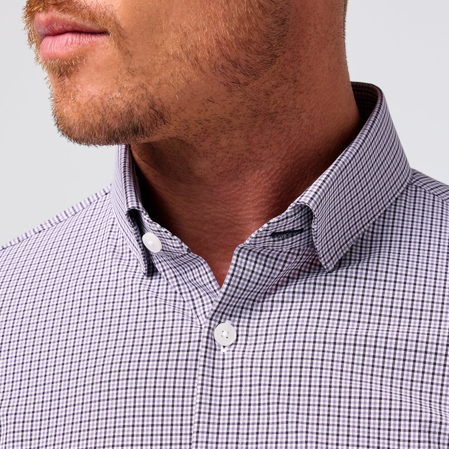 Mizzen + Main Leeward long sleeve dress shirt in purple and white gingham plaid pattern with white buttons