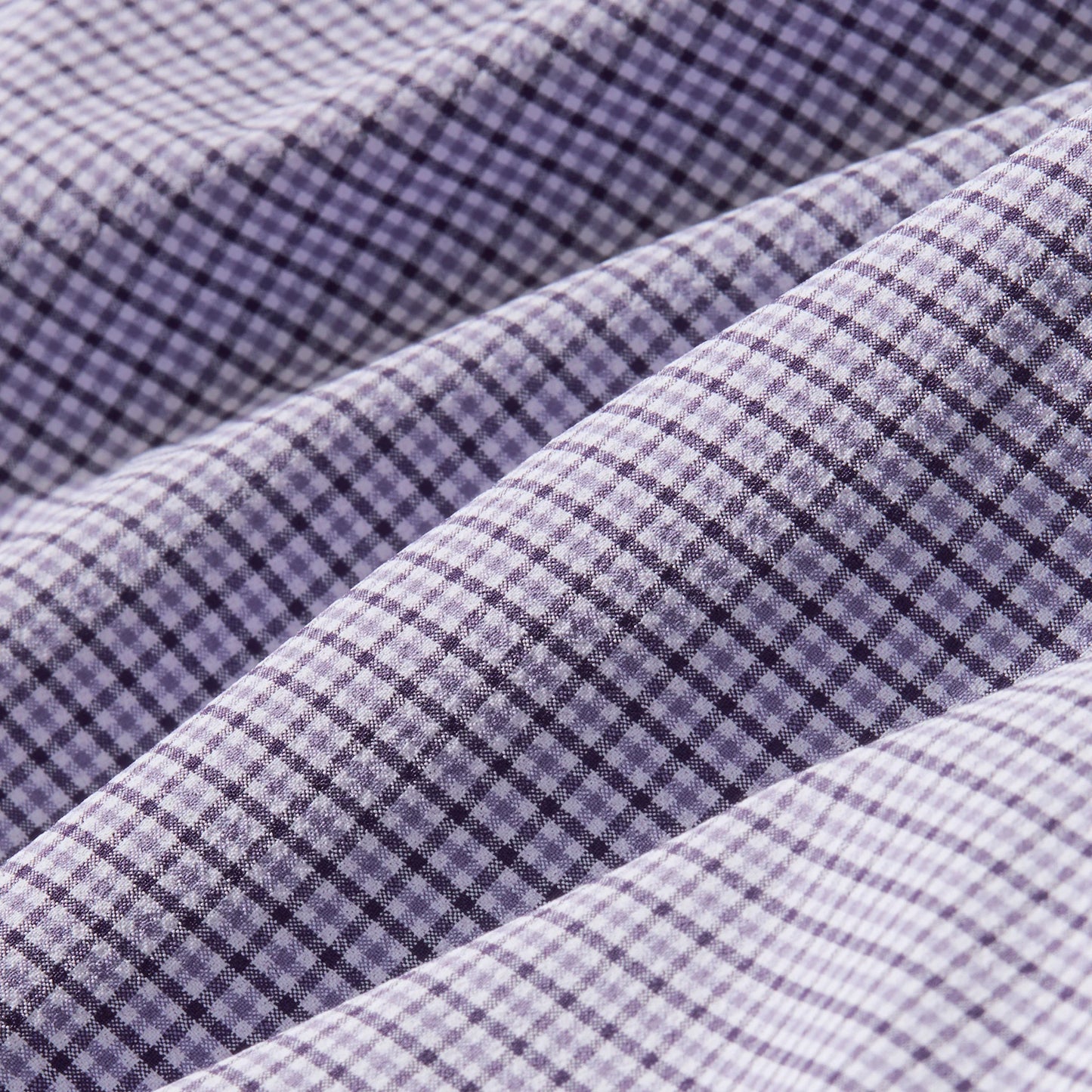 Mizzen + Main Leeward long sleeve dress shirt featuring purple and white gingham plaid pattern with folded fabric detail.