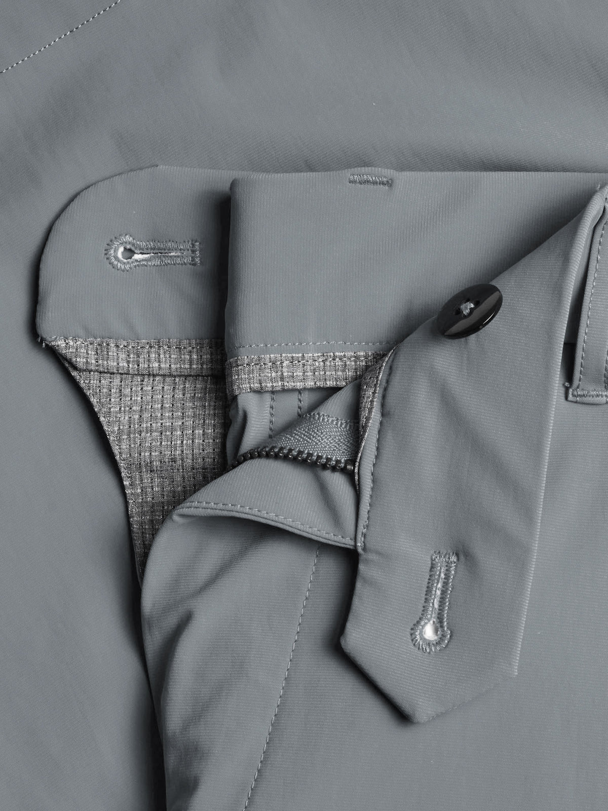 Greyson Montauk shorts showing detailed waistband construction with button closure and interior fabric lining.