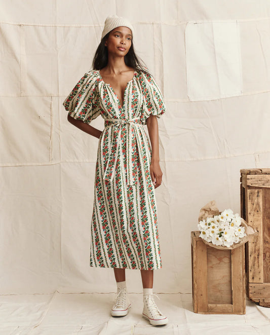 The Great midi dress with floral tapestry print, puff sleeves, deep V-neck, and tie waist belt.