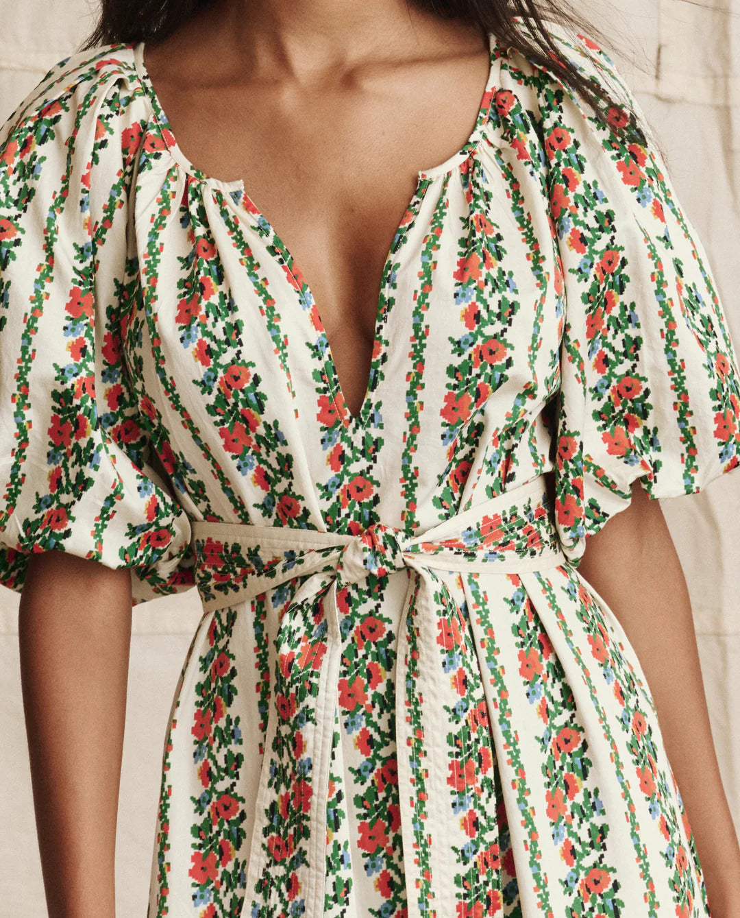 The Great floral print midi dress with puffed sleeves, deep V-neckline, and tie waist belt featuring red and green flower ...