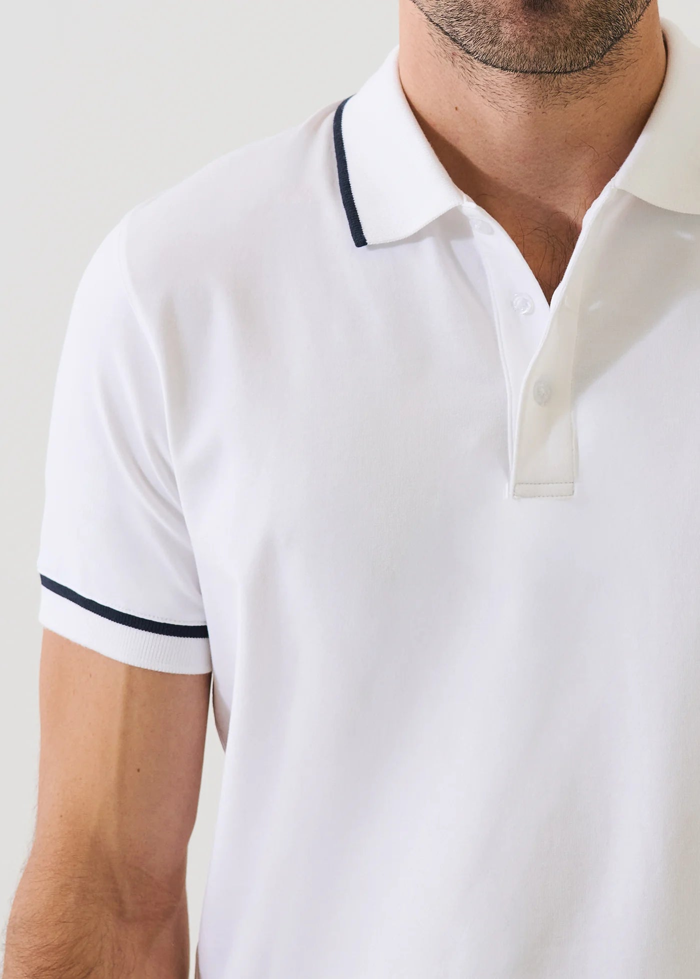 Patrick Assaraf white short-sleeve pima cotton polo shirt with navy tipping details on collar and sleeves